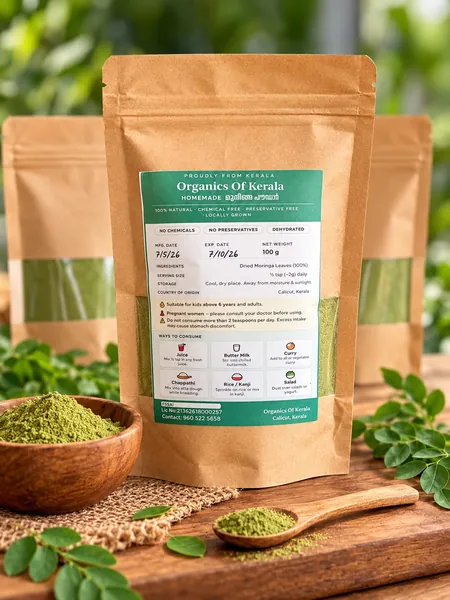 Kraft pouch of muringa powder with a wooden bowl of green powder and fresh muringa leaves